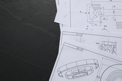 Photo of Different engineering drawings on grey textured table, flat lay. Space for text