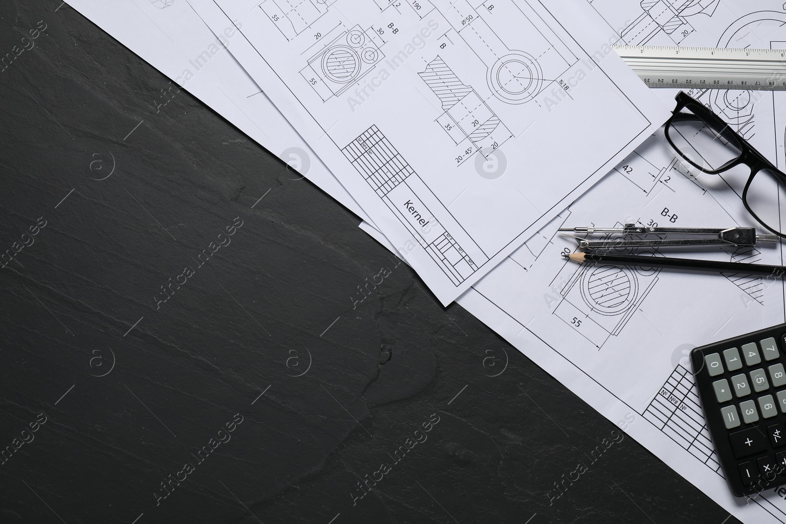 Photo of Different engineering drawings, pencil, divider and calculator on grey textured table, flat lay. Space for text