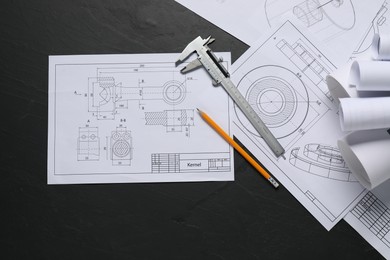 Different engineering drawings, ruler and pencil on grey textured table, flat lay