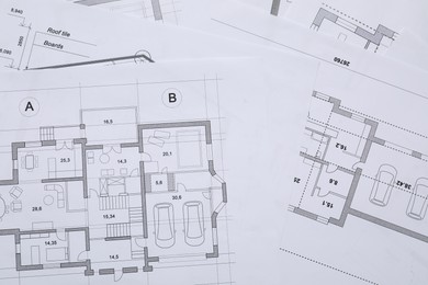 Different architectural drawings on table, flat lay