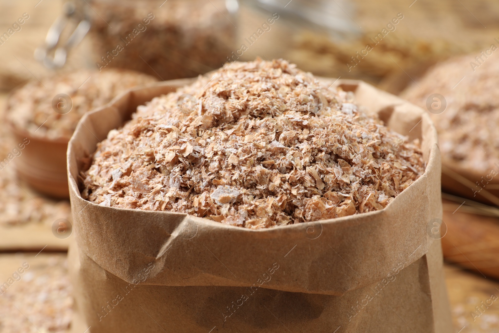 Photo of Paper bag with wheat bran, closeup view