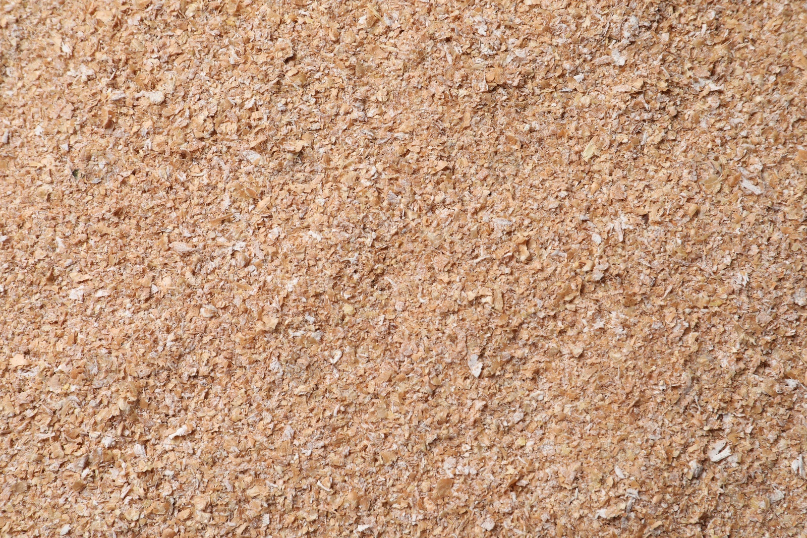 Photo of Heap of wheat bran as background, top view