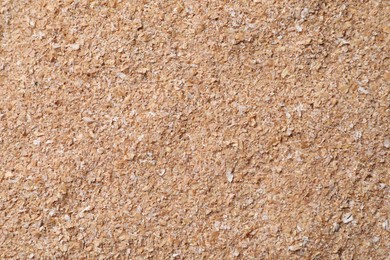 Photo of Heap of wheat bran as background, top view