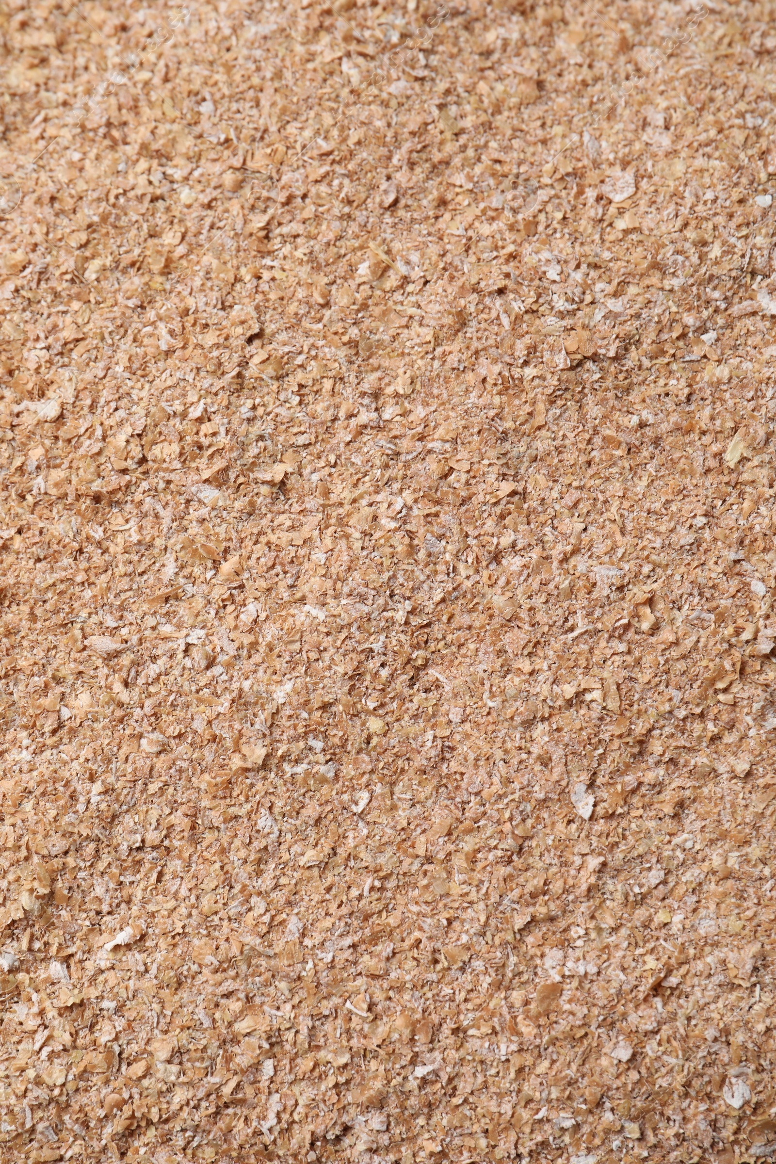 Photo of Heap of wheat bran as background, top view