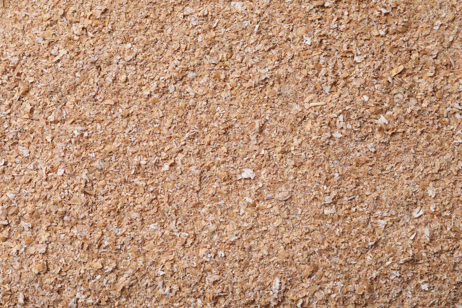 Photo of Heap of wheat bran as background, top view