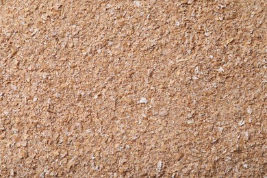 Heap of wheat bran as background, top view