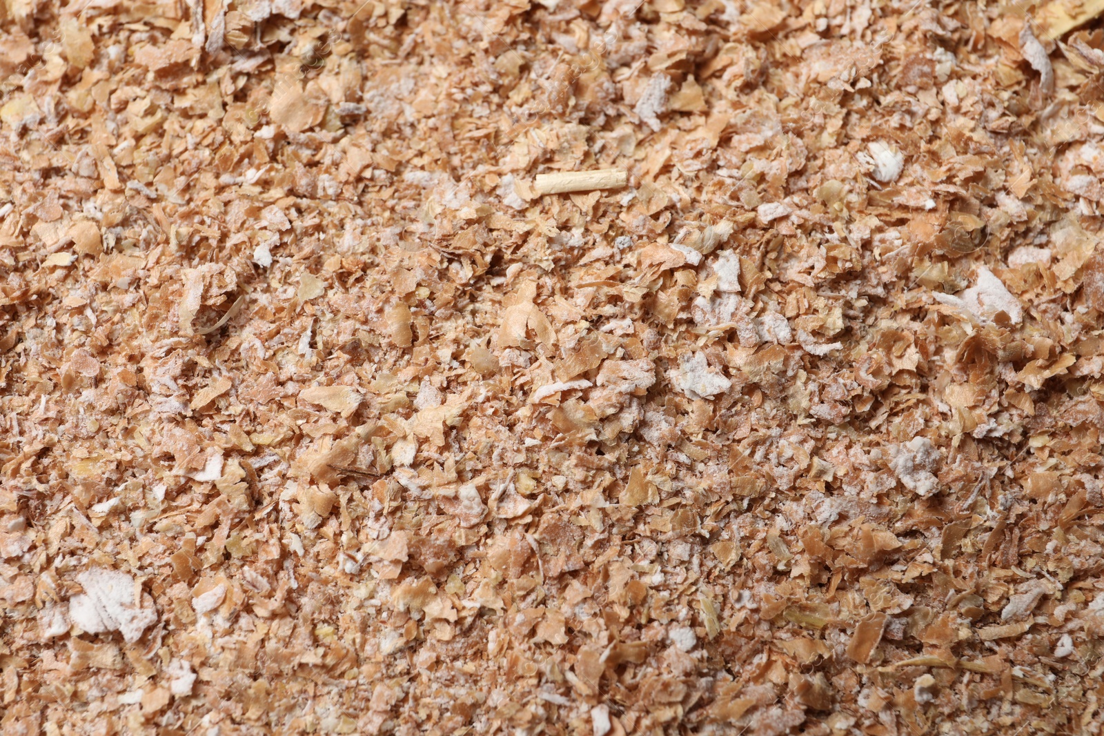 Photo of Heap of wheat bran as background, top view