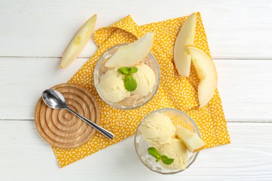 Photo of Scoops of melon sorbet with mint in glass dessert bowls, fresh fruit and spoon on white wooden table, flat lay