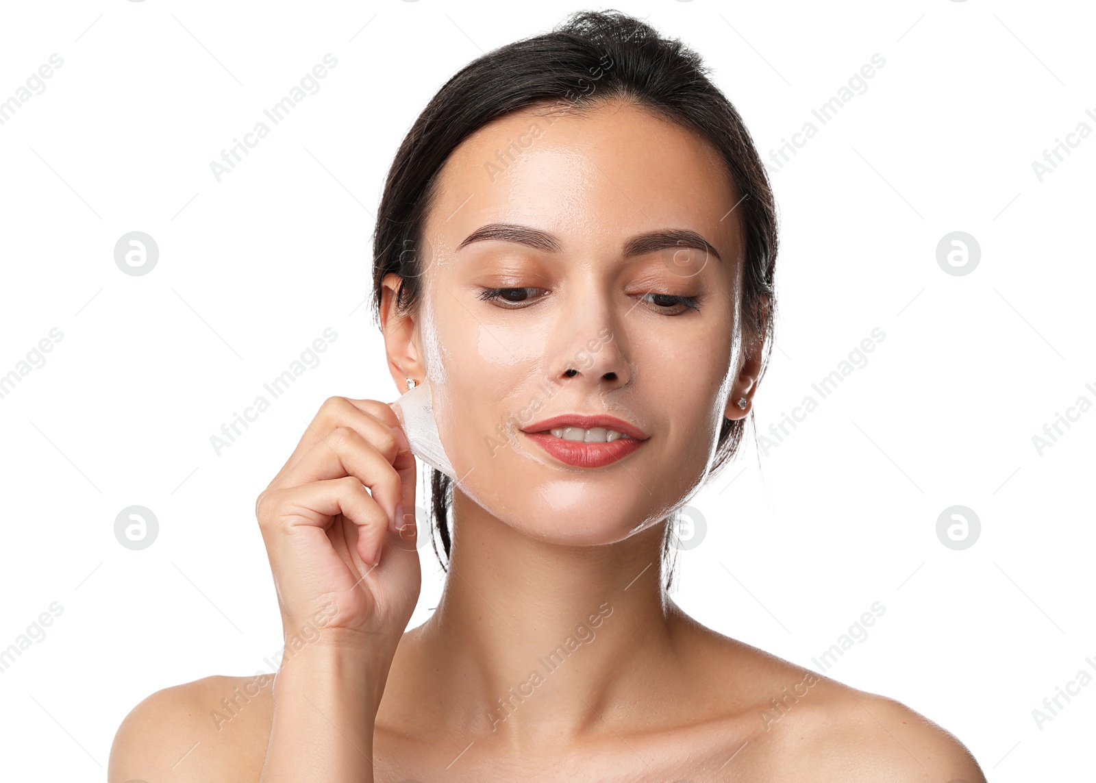 Photo of Beautiful woman peeling off face mask on white background