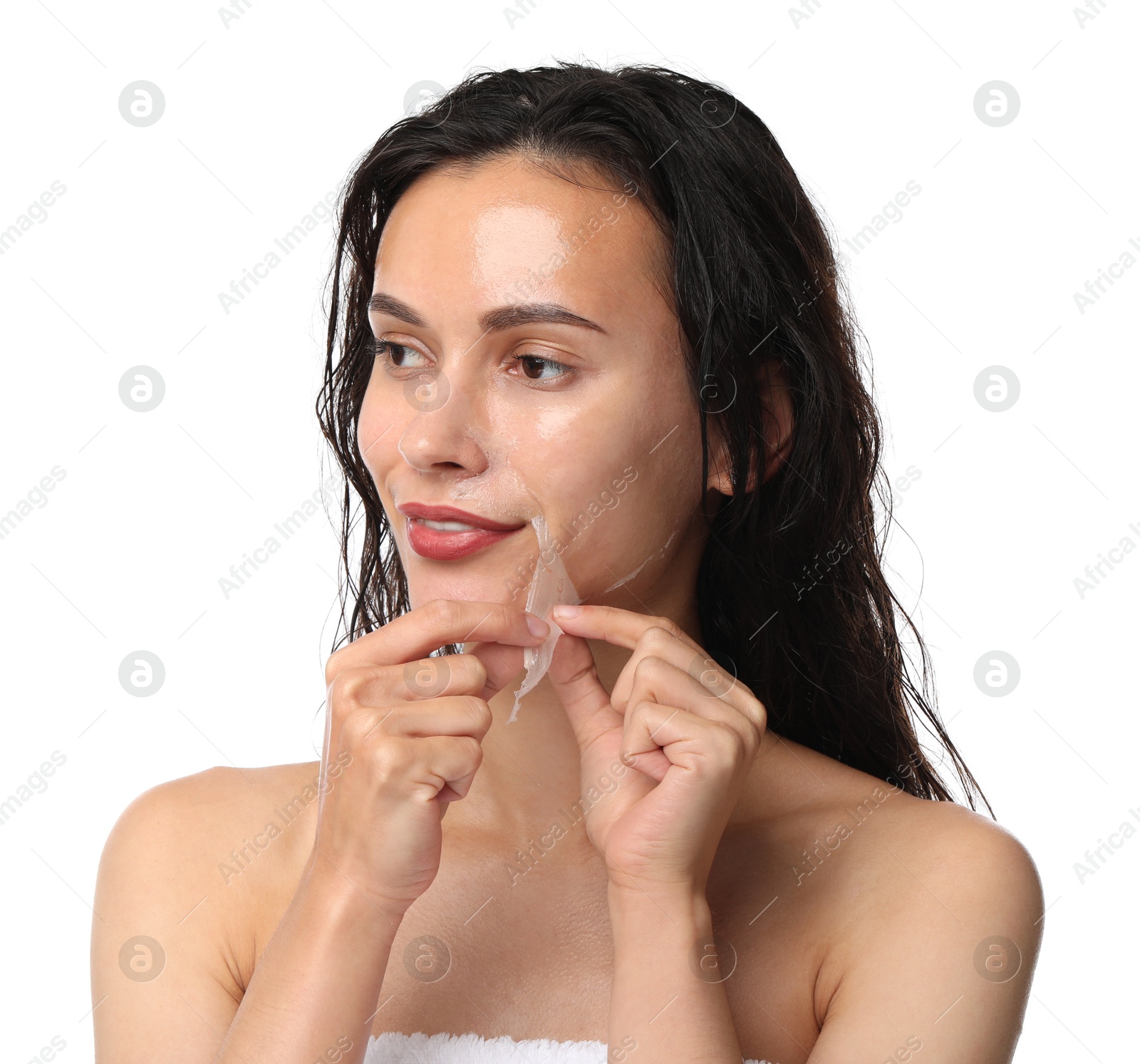 Photo of Beautiful woman peeling off face mask on white background