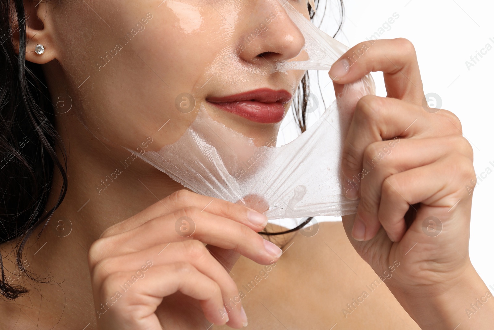 Photo of Woman peeling off face mask on white background, closeup