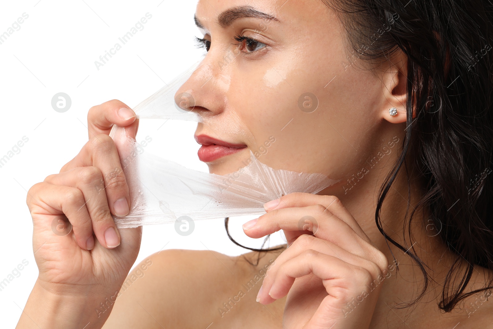 Photo of Beautiful woman peeling off face mask on white background, closeup