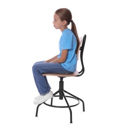 Photo of Girl with incorrect posture sitting on chair against white background