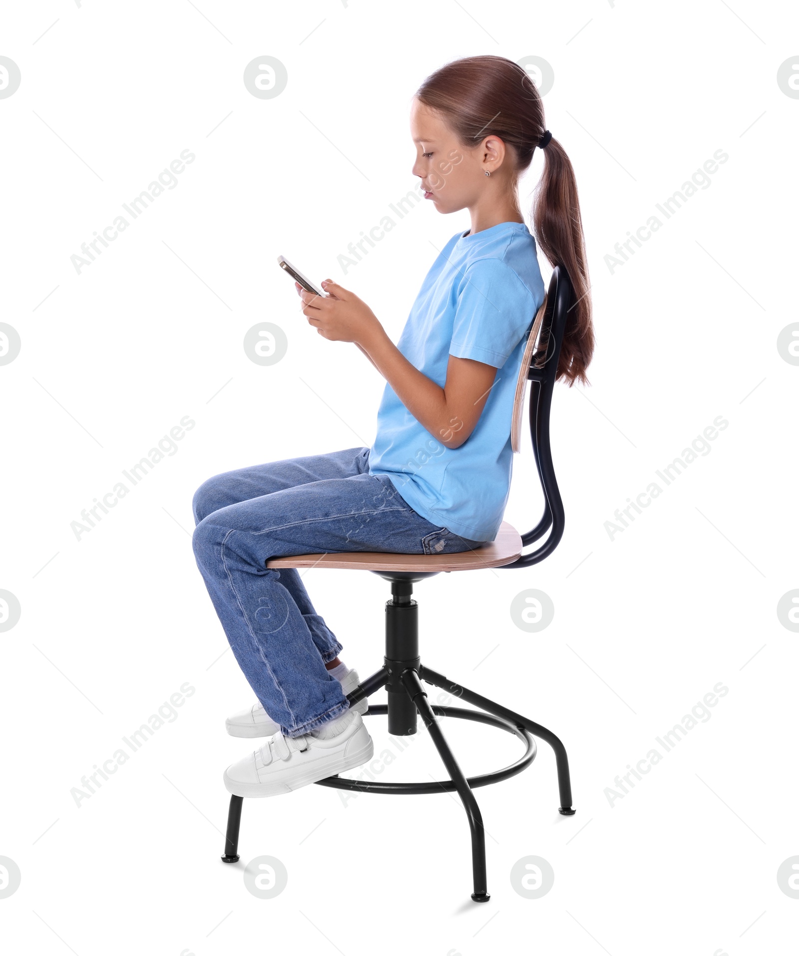 Photo of Girl with correct posture and smartphone sitting on chair against white background