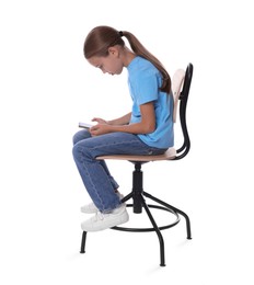 Photo of Girl with incorrect posture and smartphone sitting on chair against white background