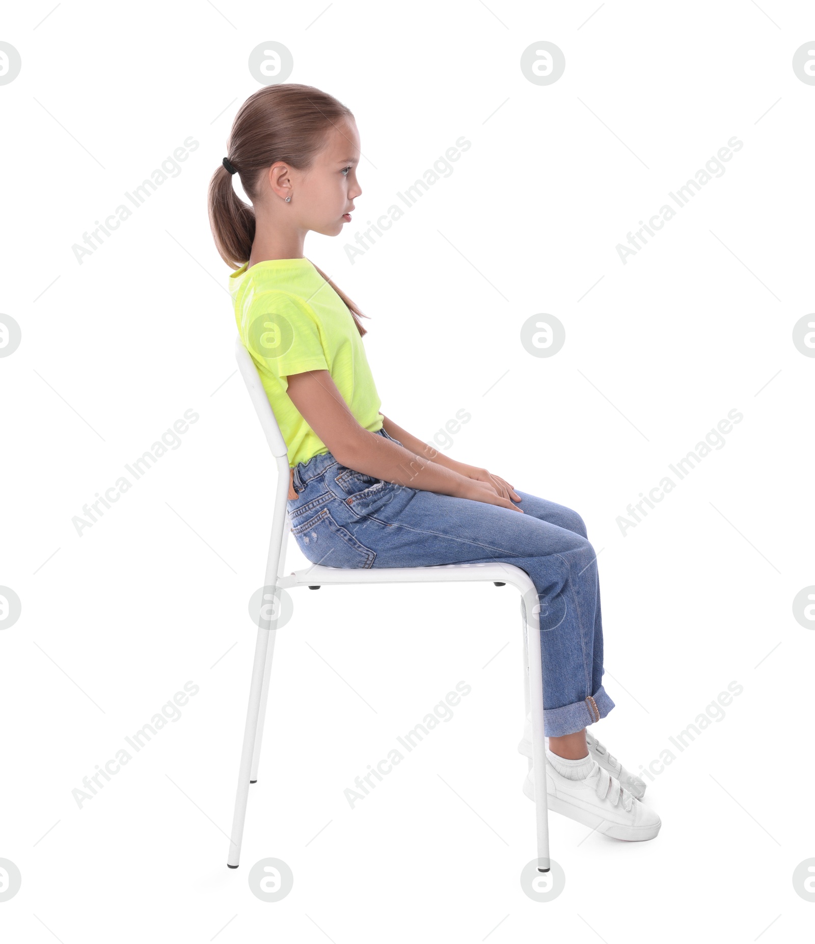 Photo of Girl with correct posture sitting on chair against white background