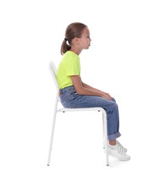 Photo of Girl with incorrect posture sitting on chair against white background