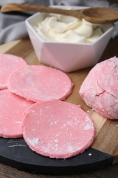 Photo of Dough for tasty homemade mochi on wooden table, closeup