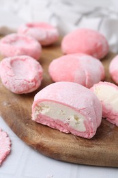 Photo of Tasty homemade mochi on white table, closeup