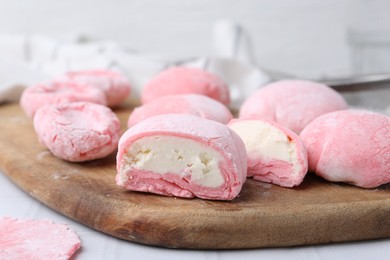 Tasty homemade mochi on white table, closeup