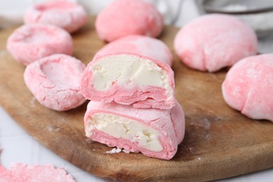 Tasty homemade mochi on white table, closeup