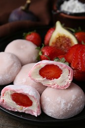 Delicious mochi with strawberries on table, closeup