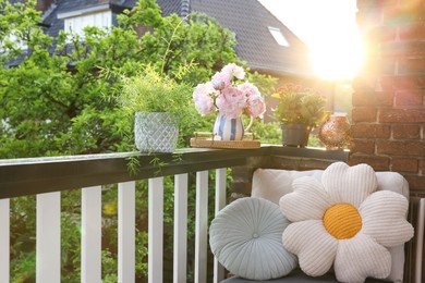 Balcony garden. Different plants growing on railings outdoors