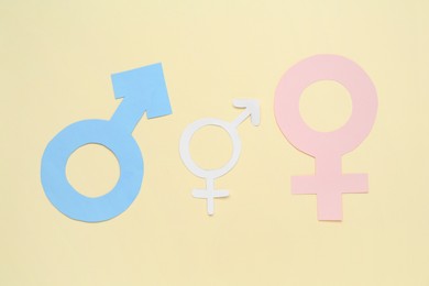 Gender equality concept. Male and female figures on beige background, flat lay