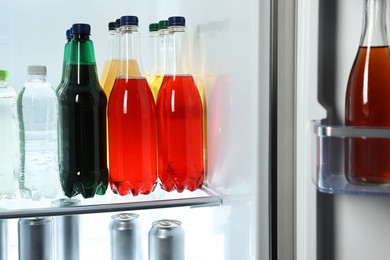 Many different cold drinks in refrigerator, closeup