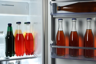 Many different cold drinks in refrigerator, closeup