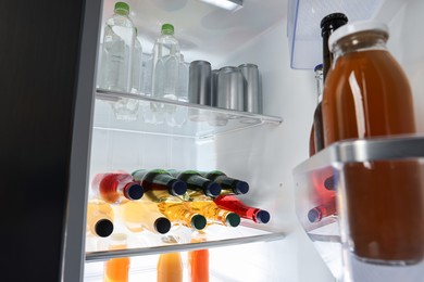 Many different cold drinks in refrigerator, closeup