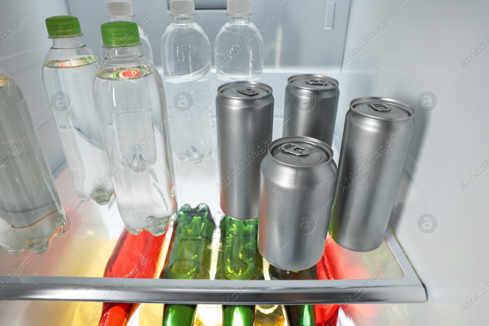 Photo of Many different cold drinks in refrigerator, closeup