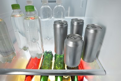 Photo of Many different cold drinks in refrigerator, closeup