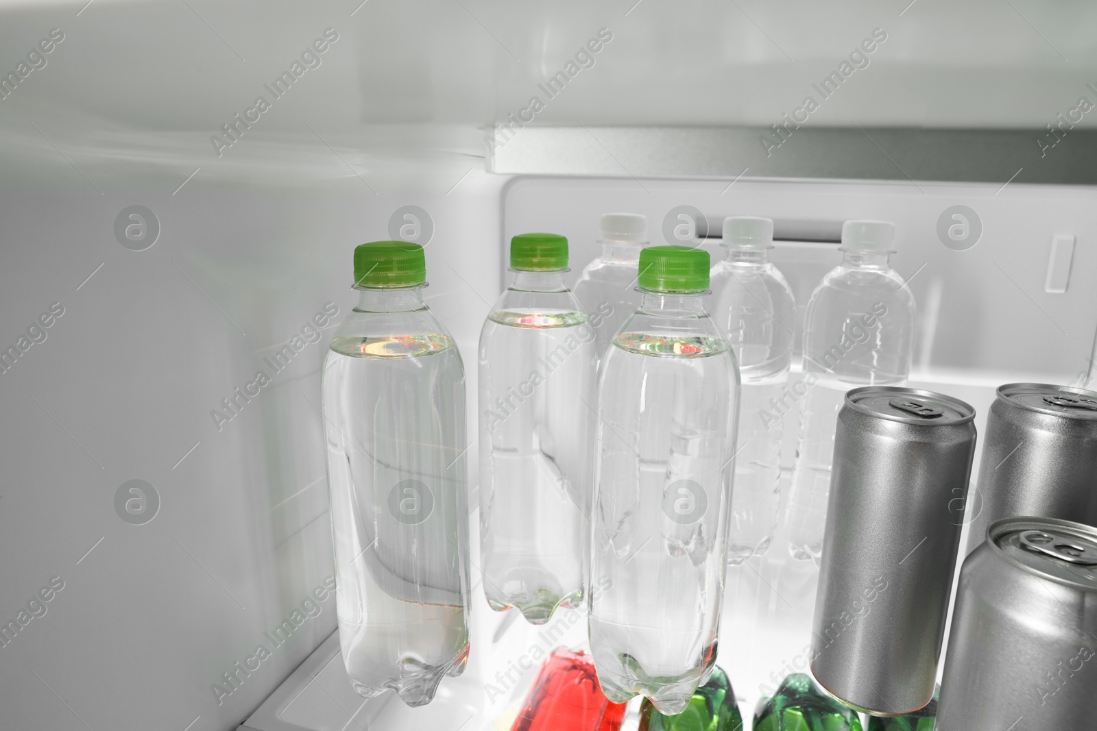 Photo of Many different cold drinks in refrigerator, closeup