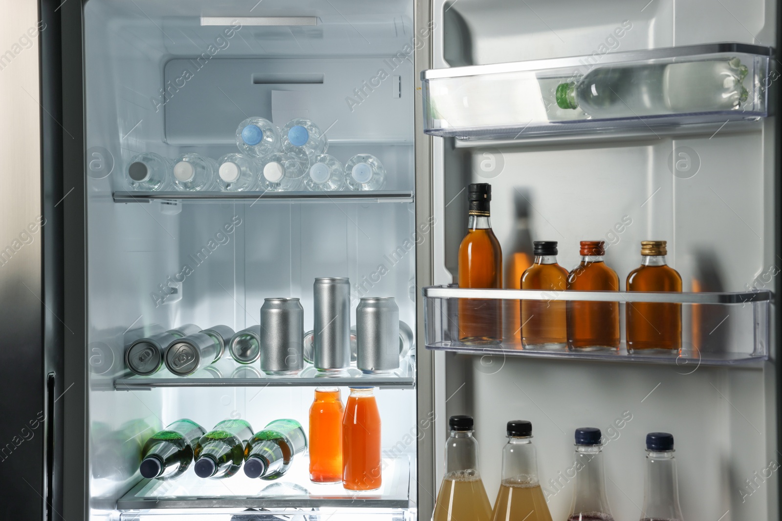 Photo of Many different cold drinks in refrigerator, closeup