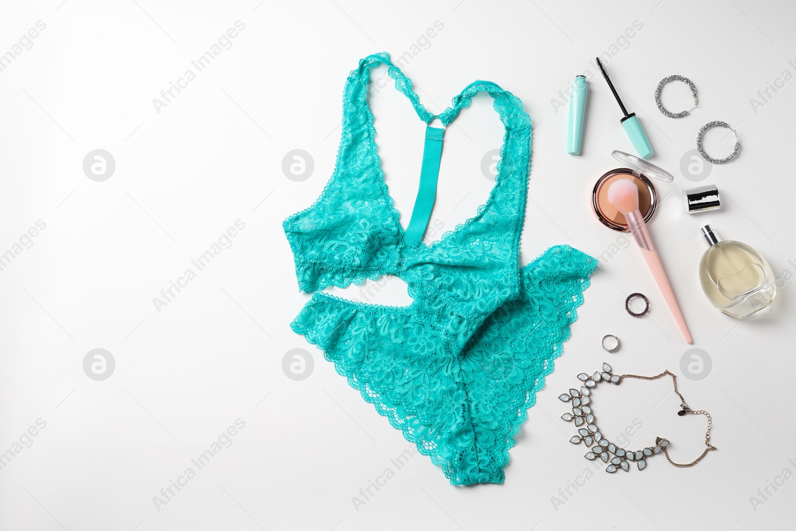 Photo of Beautiful lace lingerie and accessories on white background, flat lay. Space for text