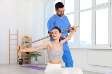 Photo of Patient exercising under physiotherapist supervision in rehabilitation center