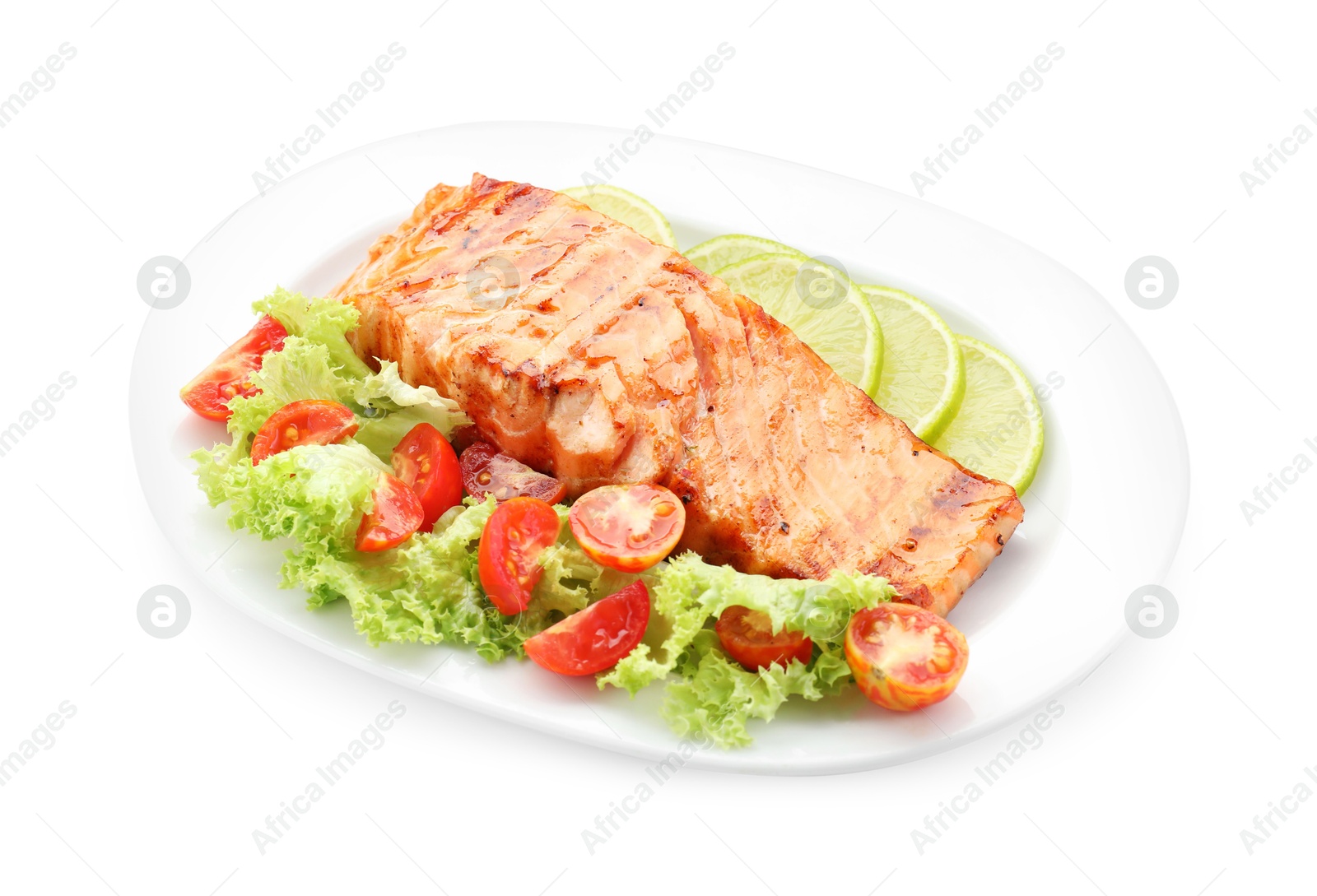 Photo of Delicious grilled salmon fillet with vegetable salad and lime isolated on white