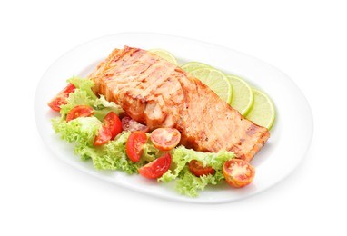 Photo of Delicious grilled salmon fillet with vegetable salad and lime isolated on white