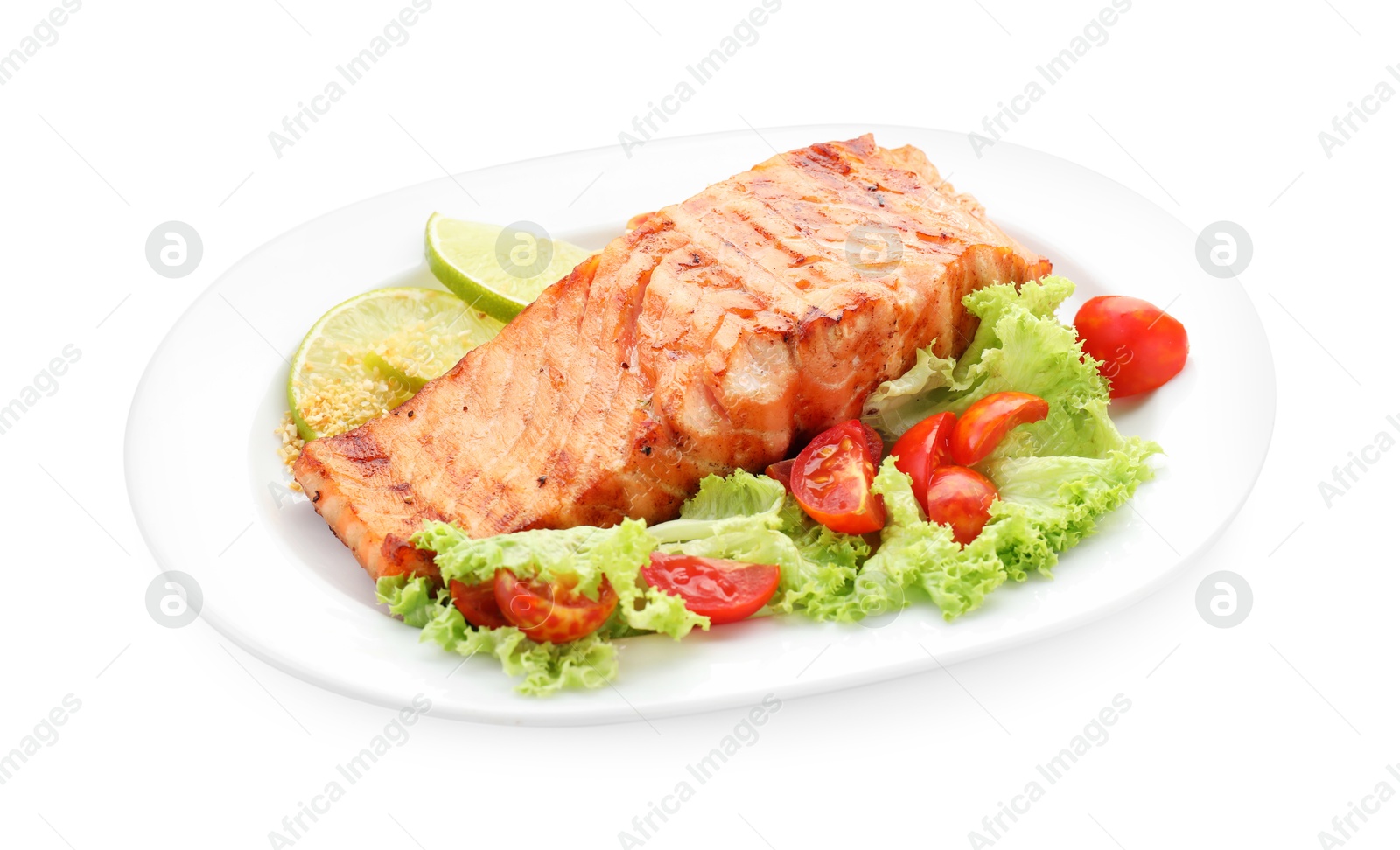 Photo of Delicious grilled salmon fillet with vegetable salad and lime isolated on white