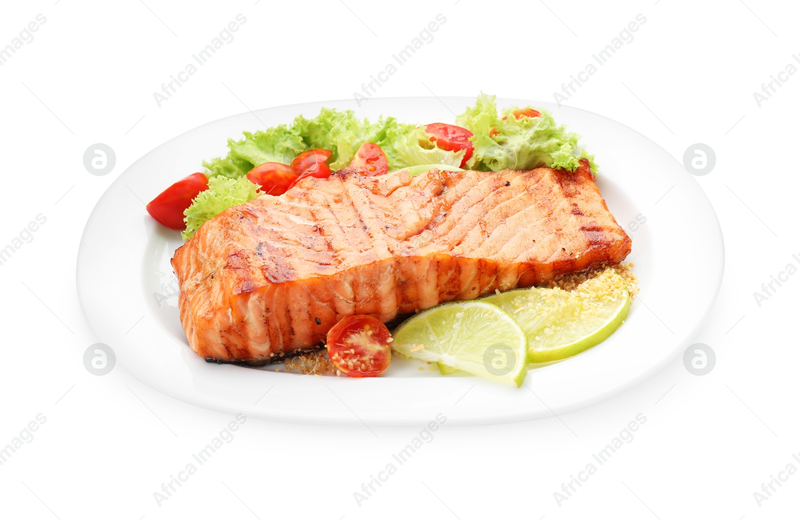 Photo of Delicious grilled salmon fillet with vegetable salad and lime isolated on white