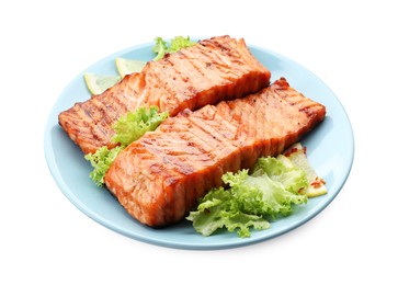 Delicious grilled salmon fillets with lettuce and lemon isolated on white