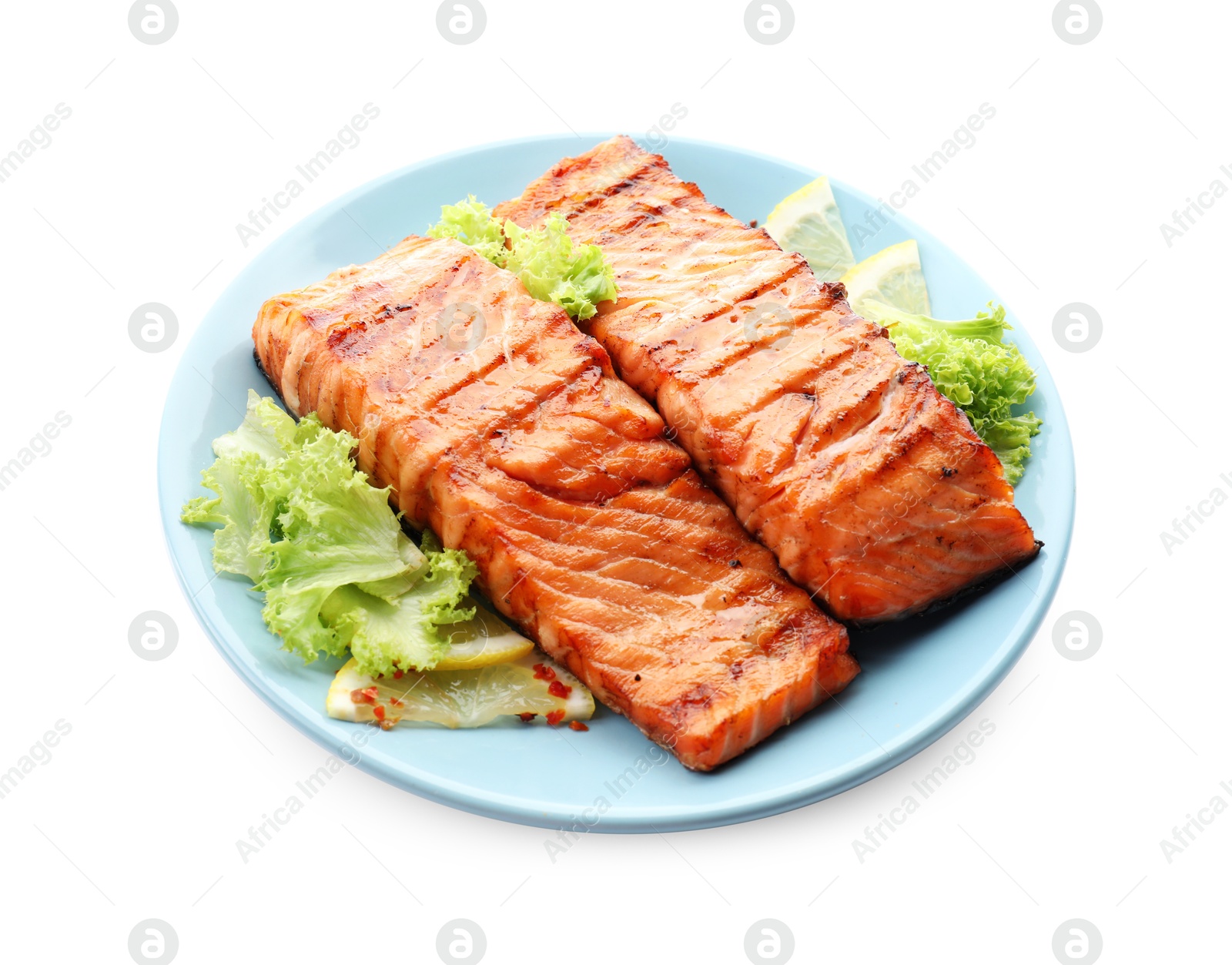 Photo of Delicious grilled salmon fillets with lettuce and lemon isolated on white