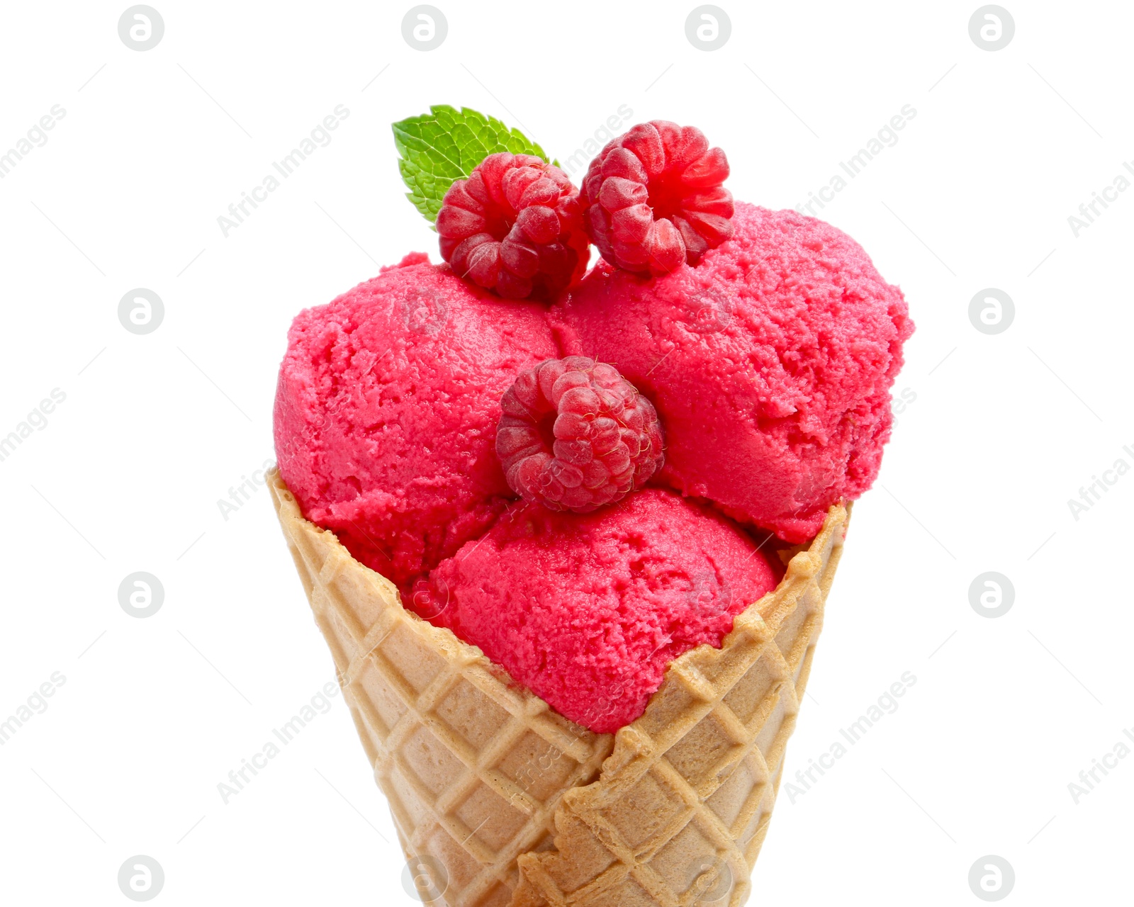 Photo of Wafer cone with delicious raspberry sorbet, mint and fresh berries isolated on white