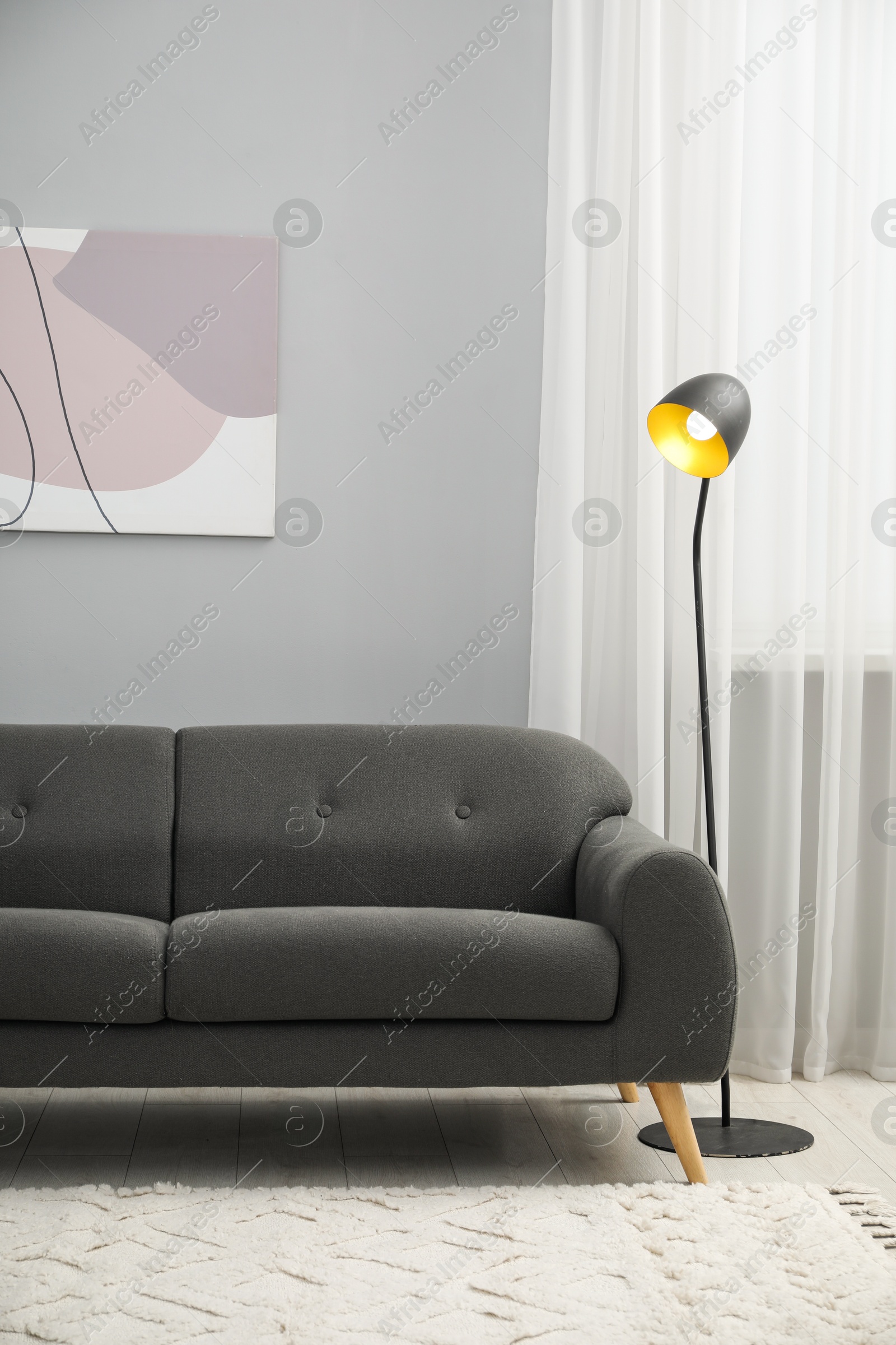 Photo of Comfortable couch in living room. Interior design