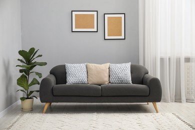 Photo of Comfortable couch in living room. Interior design