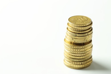 Photo of Stacked euro coins on white background, space for text