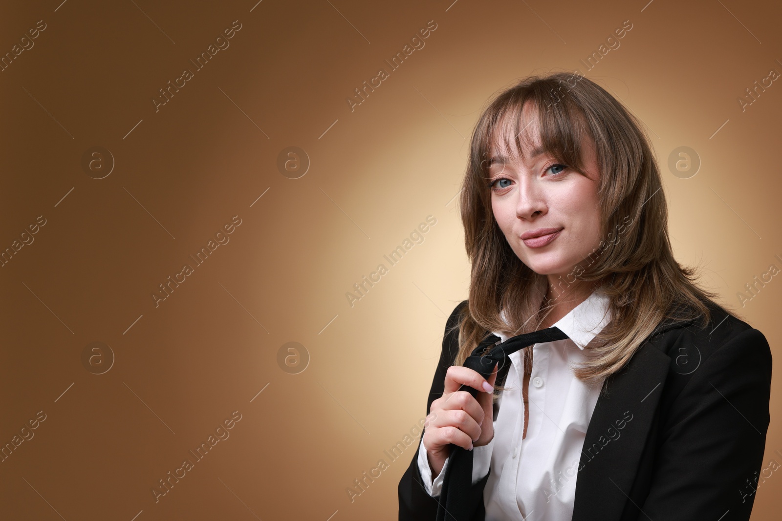 Photo of Attractive woman with stylish haircut on brown gradient background, space for text