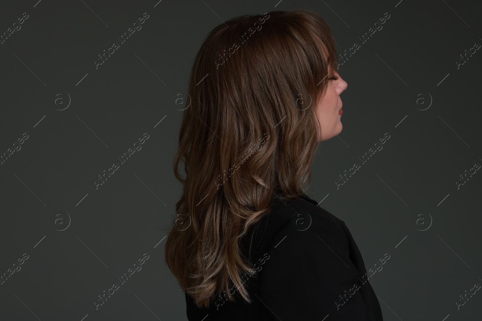 Photo of Attractive woman with stylish haircut on grey background