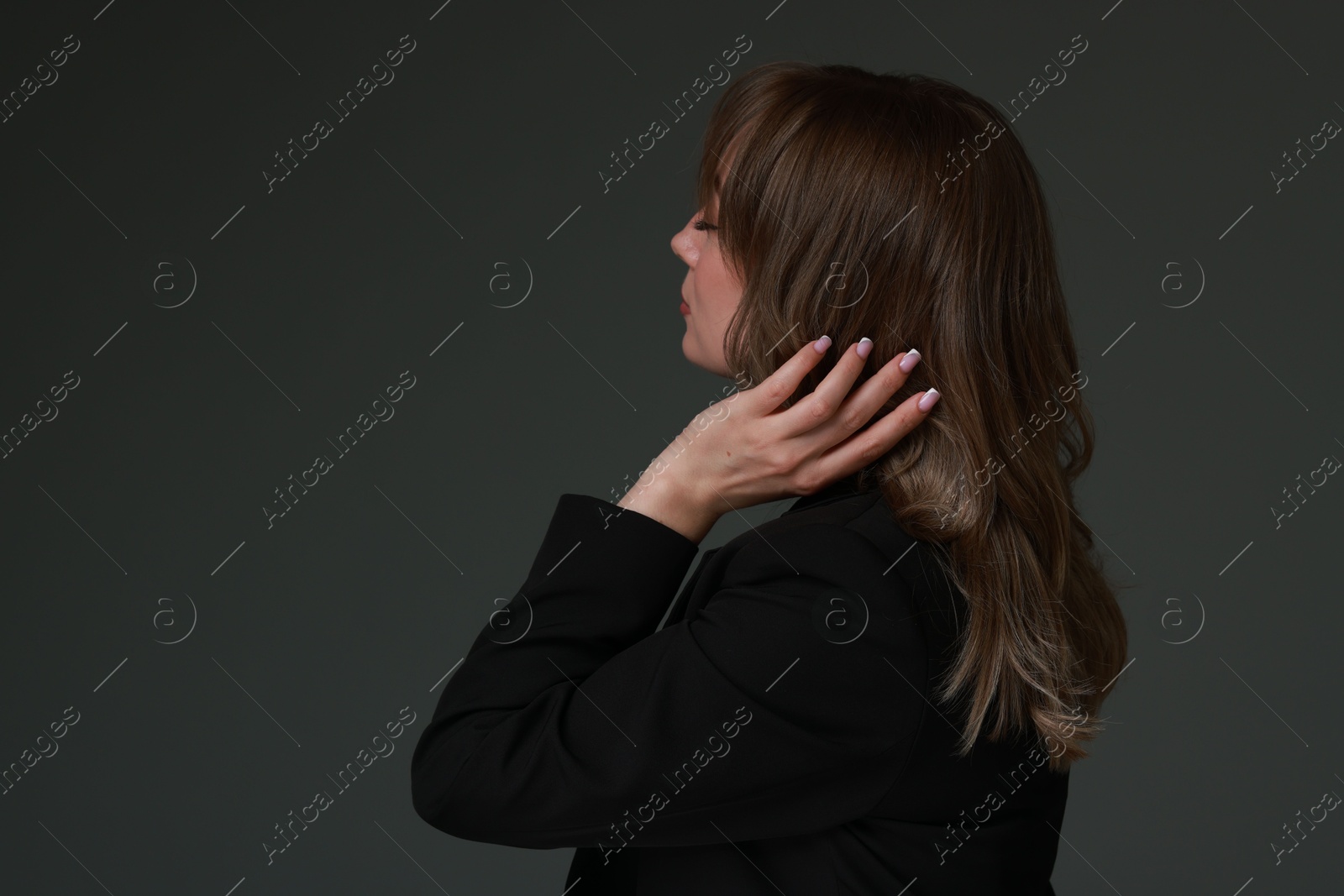 Photo of Attractive woman with stylish haircut on grey background